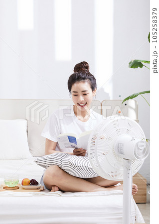 summer lifestyle, korean asian young woman with bed and book summer lifestyle, korean asian young woman with bed and book 105258379