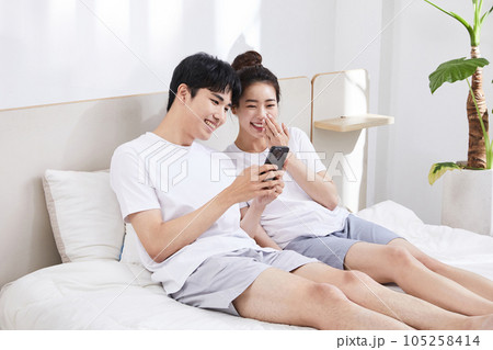 summer lifestyle, korean asian young couple with bed 105258414