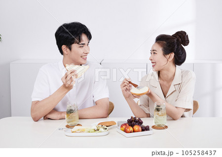 summer lifestyle, korean asian young couple having sandwich summer lifestyle, korean asian young couple having sandwich 105258437