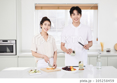summer lifestyle, korean asian young couple cooking in kitchen 105258459