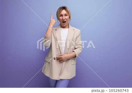 smart sought-after blond 30s business woman in a jacket on a background with copy space 105260743