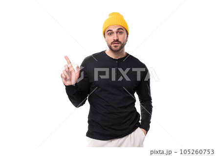 smart authentic brunet male adult in a black sweater talks about an idea on a white background with 105260753