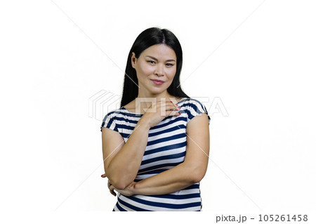 Portrait of a young brunette asian woman in a striped t-shirt. Isolated on white background. 105261458