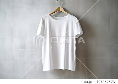 A white T-shirt is hanging on a hanger. A white T-shirt is hanging on a hanger. 105262573