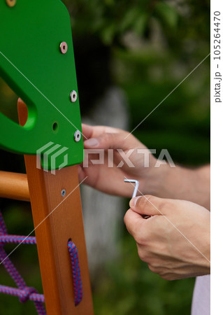 Dad collects wooden home sports complex outdoor. 105264470