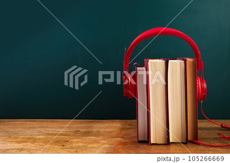 audio book concept with stack of books and headphones. audio book concept with stack of books and headphones. 105266669