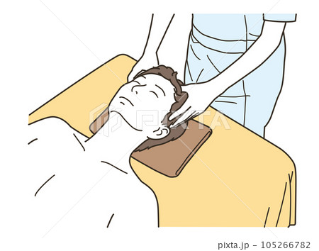 ベッドでヘッドスパの施術を受ける若い男性 105266782