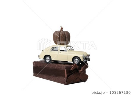 PNG, a toy car with a gift and a pumpkin on the roof, isolated on white background 105267180