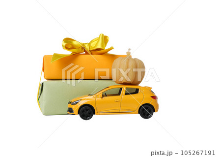 PNG, a toy car with a gift and a pumpkin on the roof, isolated on white background PNG, a toy car with a gift and a pumpkin on the roof, isolated on white background 105267191