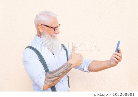 Senior man with a phone 105268981