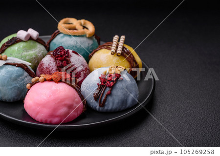 Delicious sweet colorful mochi desserts or ice cream with rice dough and toppings 105269258