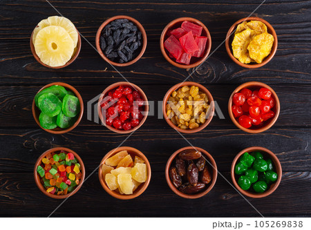 Group of dried and candied fruit in bowl 105269838