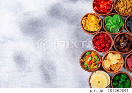 Group of dried and candied fruit in bowl 105269841
