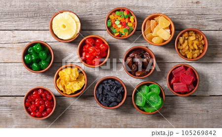 Group of dried and candied fruit in bowl 105269842