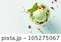 Advertising shot, green nut ice cream ball with pistachios in a cup, top view, isolated on light green background. High quality illustration 105275067