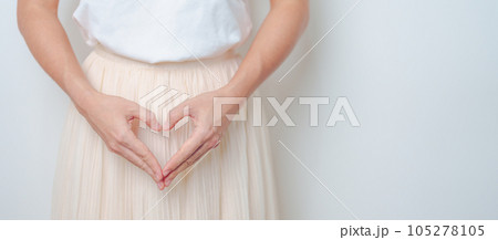 Woman hand heart shape over abdomen. Ovarian and Cervical cancer, Endometriosis, Hysterectomy, Uterine fibroids, Reproductive, menstruation, Stomach, Pregnancy and Sexual Transmitted disease concept 105278105