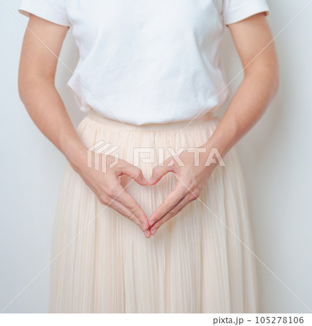 Woman hand heart shape over abdomen. Ovarian and Cervical cancer, Endometriosis, Hysterectomy, Uterine fibroids, Reproductive, menstruation, Stomach, Pregnancy and Sexual Transmitted disease concept 105278106
