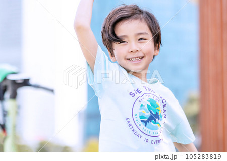 happy asian child girl smiling with her arms raised 105283819