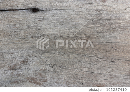 Old vintage dirty cracked wood surface texture background Old vintage dirty cracked wood surface texture background 105287410