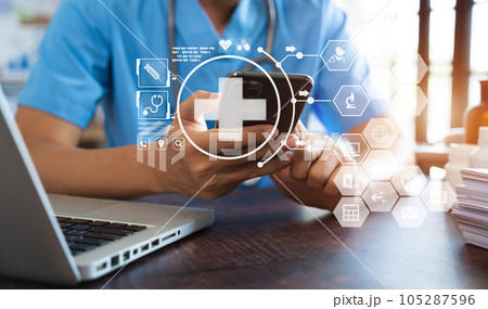 Medical Technology Concepts The doctor is working on a smartphone and a digital tablet computer in a modern office in the morning at the desk 105287596