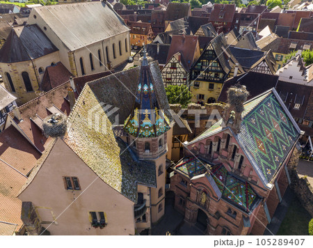Aerial Drone Shot of Eguisheim village in the Alsace province, France. Picturesque village in a Sunny Summer Day Aerial Drone Shot of Eguisheim village in the Alsace province, France. Picturesque village in a Sunny Summer Day 105289407