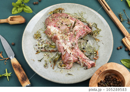 Raw barbecue Tomahawk steak 105289583