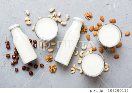 Set or collection of various vegan milk almond, cashew, on table background. Vegan plant based milk and ingredients, top view Set or collection of various vegan milk almond, cashew, on table background. Vegan plant based milk and ingredients, top view 105290113