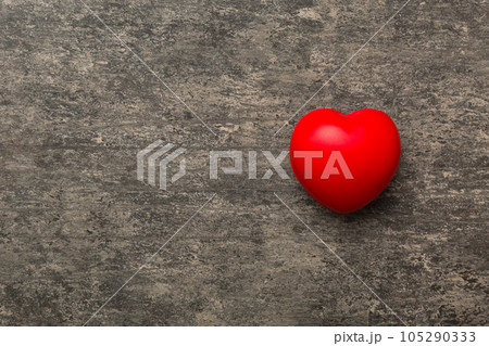 red heart shape on colored background. minimal concept top view with copy space 105290333