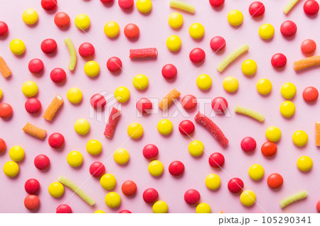 colorful candies as background top view. Seamless pattern with candy. Many sweet candies close-up colorful candies as background top view. Seamless pattern with candy. Many sweet candies close-up 105290341
