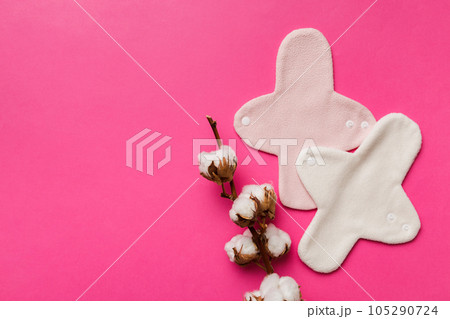 set of colorful bright reusable menstrual pads with cotton flower. zero waste woman periods concept top view with copy space 105290724