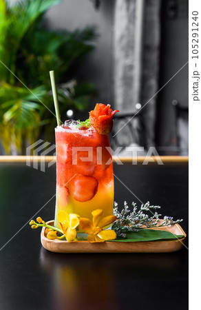 Fresh summer drink with strawberry jam and orange juice  105291240