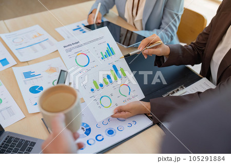 Asian business adviser meeting to analyze and discuss the situation on the financial report in the meeting room. Investment Consultant, Financial advisor and accounting concept Asian business adviser meeting to analyze and discuss the situation on the financial report in the meeting room. Investment Consultant, Financial advisor and accounting concept 105291884