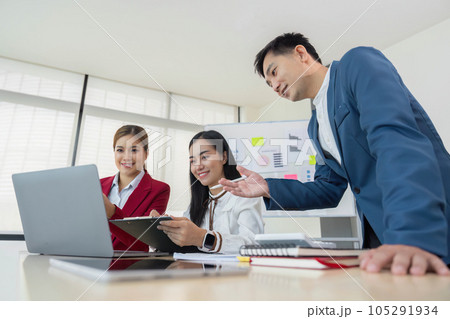 A group of Asian business people meets. have pointed to discussion graphs and data analysis charts and graphs of business finance and management concepts A group of Asian business people meets. have pointed to discussion graphs and data analysis charts and graphs of business finance and management concepts 105291934