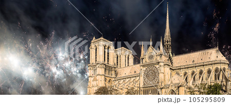 Celebratory fireworks over the Notre Dame de Paris, also known as Notre Dame Cathedral or simply Notre Dame, is a Gothic, Roman Catholic cathedral of Paris, France 105295809