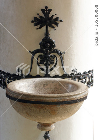 Holy water font in church of Saint Catherine of Alexandria in Zagreb, Croatia Holy water font in church of Saint Catherine of Alexandria in Zagreb, Croatia 105300068