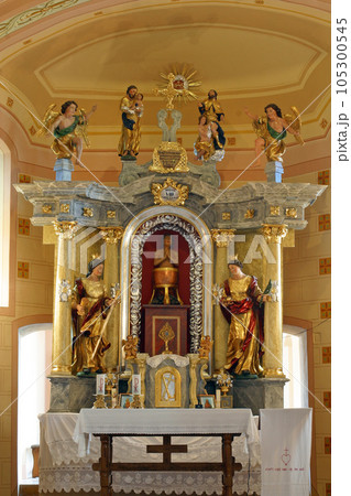 Saint Vitus between St Barbara and St. Lucia, main altar in Chapel of Saint Vitus in Komor Zacretski, Croatia 105300545