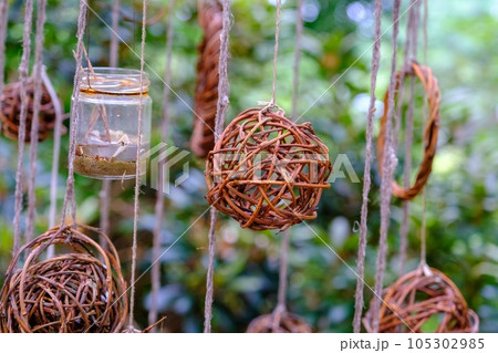 wicker decorations, balls. decorations, visual elements hung in strings 105302985