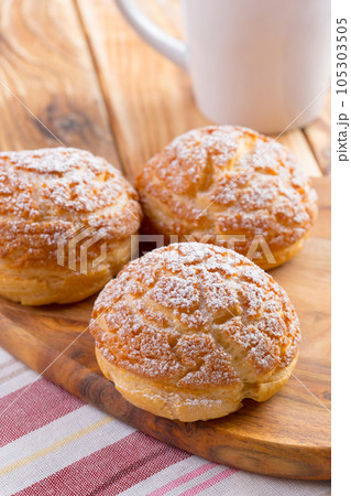 Heap of oat cookies on wooden board Heap of oat cookies on wooden board 105303505