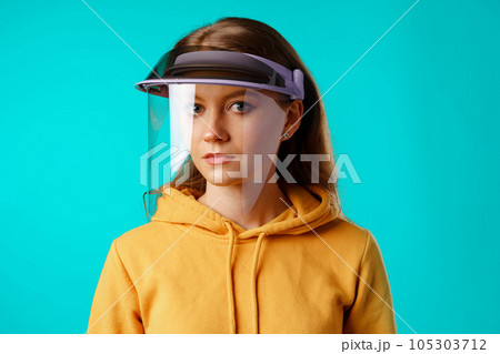 Young woman wearing medical protective face shield 105303712