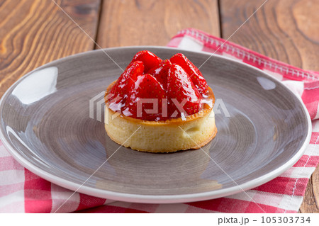 Mini tart with strawberries close up. Berry dessert 105303734
