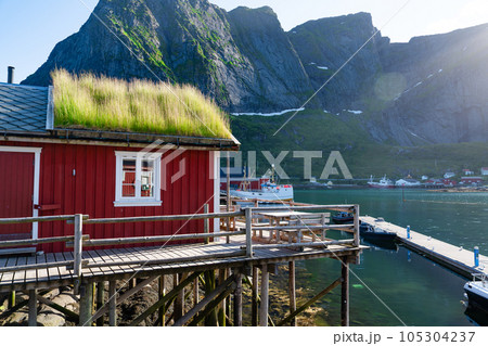 Norway. Fishermans red rorbu cottage in the Lofoten Islands. Typical Fishermans house. 105304237