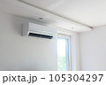 White air conditioning on the white wall in the apartment. 105304297