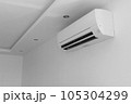 White air conditioning on the white wall in the apartment. 105304299