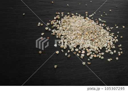 Crushed Quartz Pile, White Stone Pieces, Grit Sand, Decorative Rocks Texture on Black Background Crushed Quartz Pile, White Stone Pieces, Grit Sand, Decorative Rocks Texture on Black Background 105307295