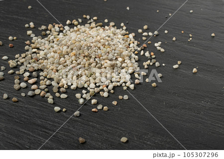 Crushed Quartz Pile, White Stone Pieces, Grit Sand, Decorative Rocks Texture on Black Background 105307296