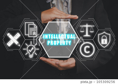Intellectual property concept, Businesswoman hand holding intellectual property icon on virtual screen. Intellectual property concept, Businesswoman hand holding intellectual property icon on virtual screen. 105309256
