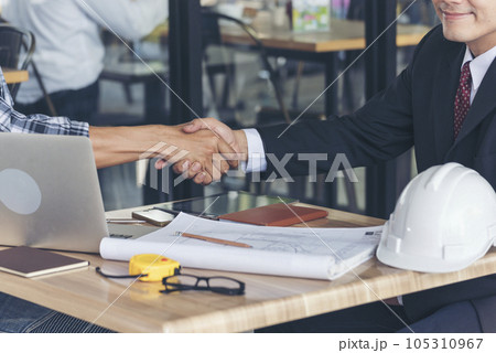 Team Business Partners shaking hands together to Greeting Start up small business in meeting room. Shakehand teamwork partners at modern office handshake together. Business mergers and acquisitions Team Business Partners shaking hands together to Greeting Start up small business in meeting room. Shakehand teamwork partners at modern office handshake together. Business mergers and acquisitions 105310967