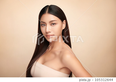 Beautiful young asian woman with clean fresh skin on beige background, Face care, Facial treatment, Cosmetology, beauty and spa, Asian women portrait. 105312644