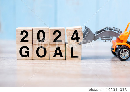2024 goal cube blocks with miniature truck or construction vehicle. New Start, Vision, Resolution, goal, industrial, Warehouse and happy New Year concept 2024 goal cube blocks with miniature truck or construction vehicle. New Start, Vision, Resolution, goal, industrial, Warehouse and happy New Year concept 105314018