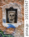 Outside light switch broken and marred by paint. 105315947